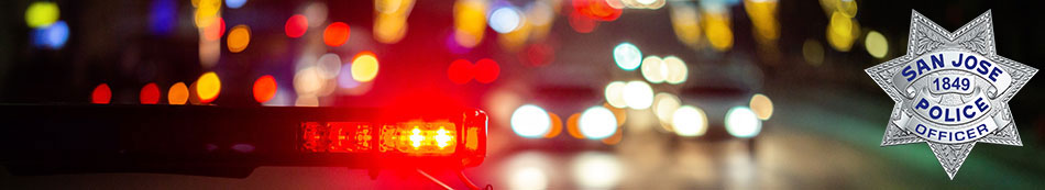 Police light bar at night with night time traffic headlights