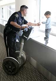 kid with a cop on a segway